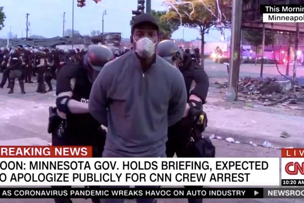 Police arrest a member of a CNN crew broadcasting live while covering protests related to the death of of African-American man George Floyd, in Minneapolis