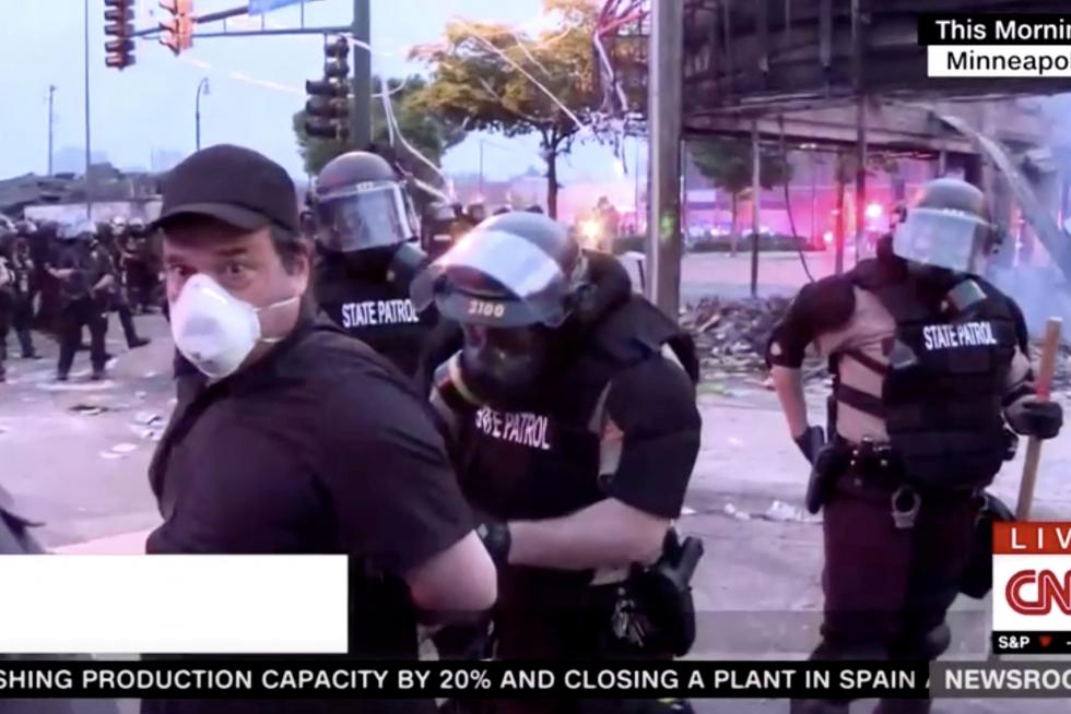 Police arrest a member of a CNN crew broadcasting live while covering protests related to the death of of African-American man George Floyd, in Minneapolis