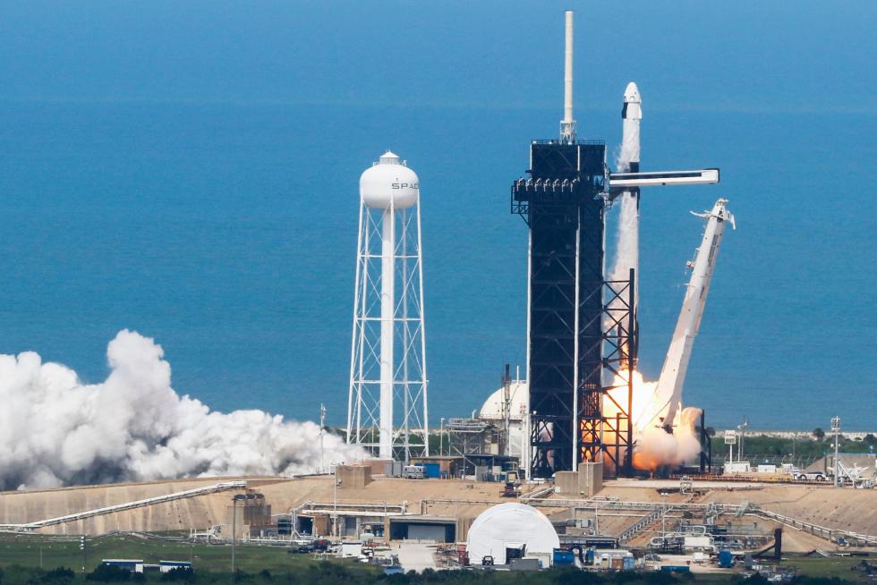 A SpaceX Falcon 9 rocket and Crew Dragon spacecraft carrying NASA astronauts Douglas Hurley and Robert Behnken launches, from Cape Canaveral