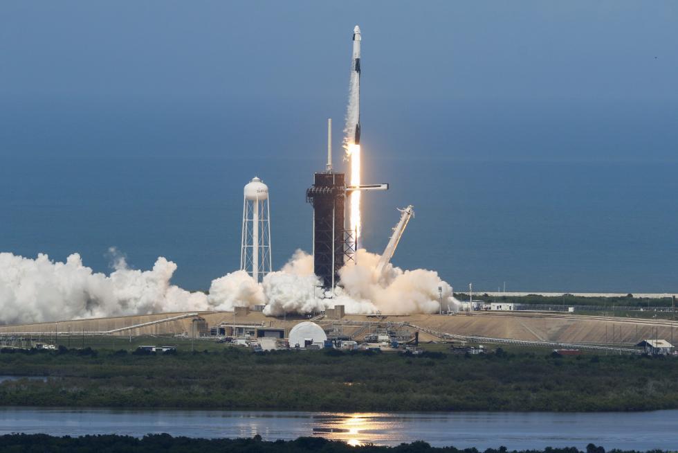A SpaceX Falcon 9 rocket and Crew Dragon spacecraft carrying NASA astronauts Douglas Hurley and Robert Behnken launches, from Cape Canaveral
