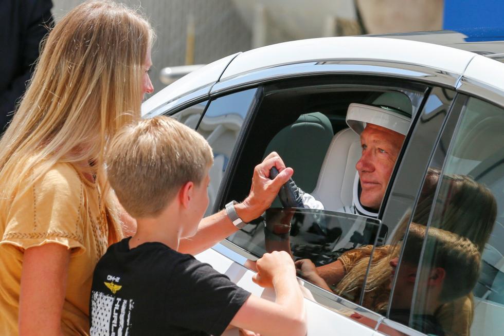 NASA astronaut Douglas Hurley's wife Karen Nyberg and their son say goodbye before the launch of a SpaceX Falcon 9 rocket and Crew Dragon spacecraft at the Kennedy Space Center, in Cape Canaveral