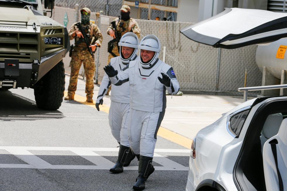 NASA astronauts Douglas Hurley and Robert Behnken head to launch pad 39 to board a SpaceX Falcon 9 rocket