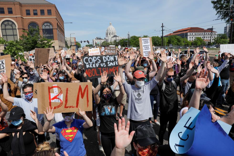 People rally against the death in Minneapolis police custody of George Floyd, in Saint Paul