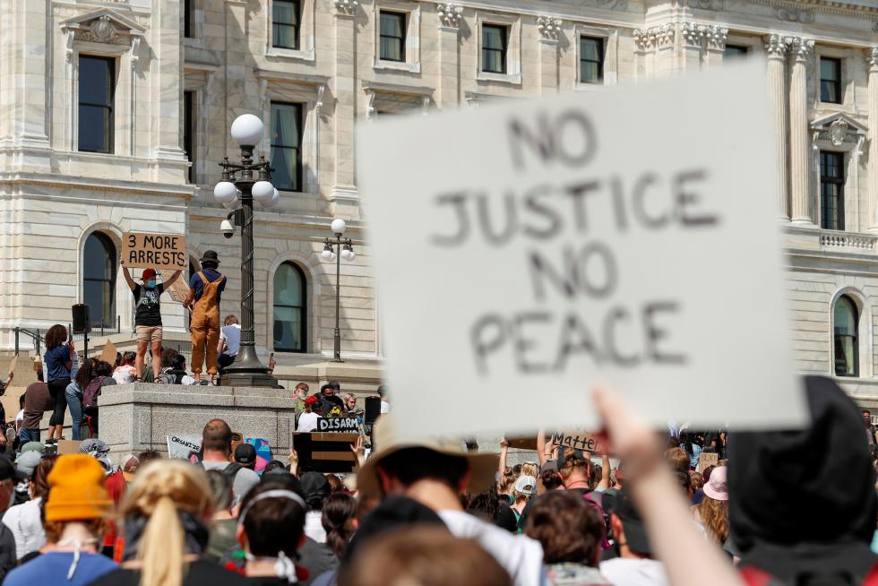 People rally against the death in Minneapolis police custody of George Floyd, in St. Paul
