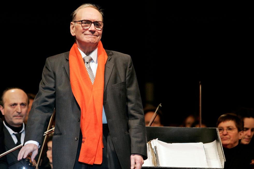 FILE PHOTO: Italian movie composer Morricone conducts the Sinfonietta orchestra during a Christmas concert in Milan