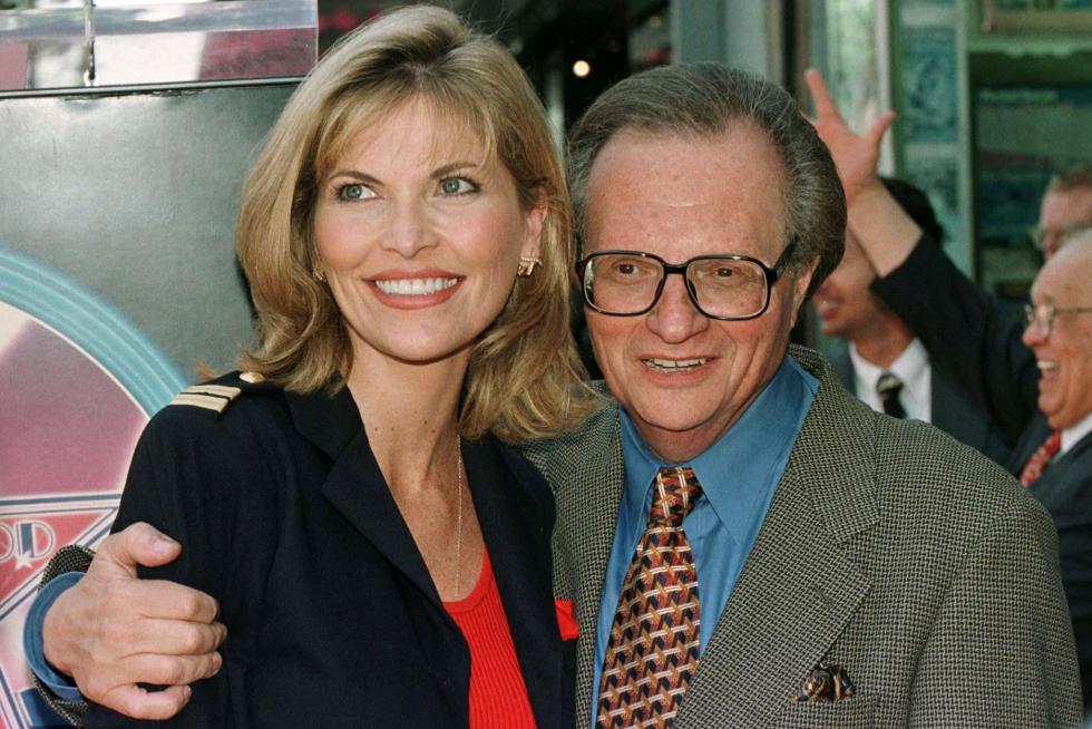 FILE PHOTO: Talk show host Larry King poses with his wife Shawn Southwick, and their sons Chance Armstrong (L) and Cannon Edward at the premiere of The PEOPLE-LARRY KING/