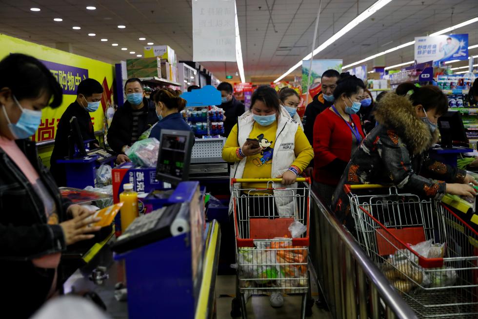 The Wider Image: 'I've let them down': Beijing's migrant workers miss family reunions on Lunar New Year