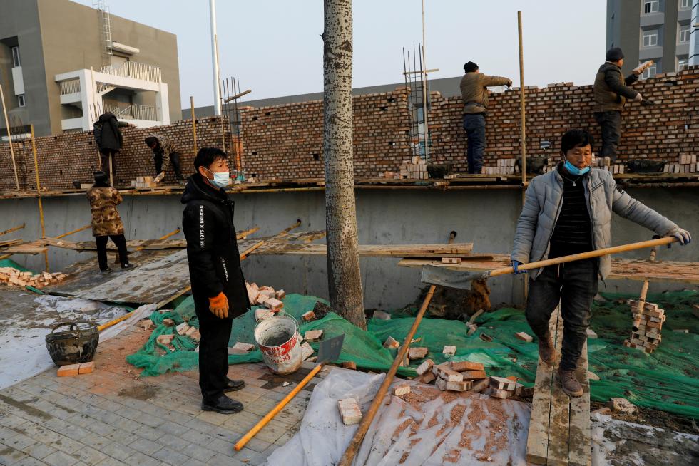 The Wider Image: 'I've let them down': Beijing's migrant workers miss family reunions on Lunar New Year