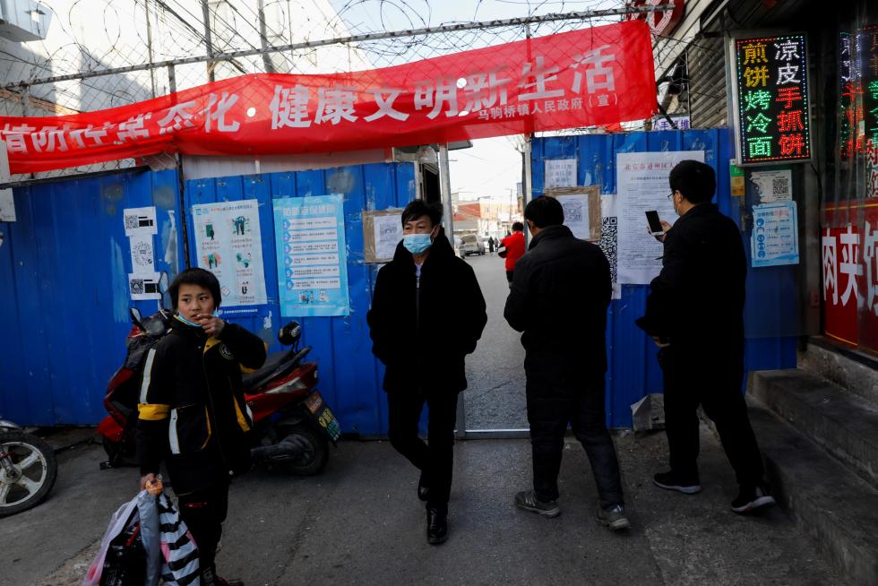 The Wider Image: 'I've let them down': Beijing's migrant workers miss family reunions on Lunar New Year