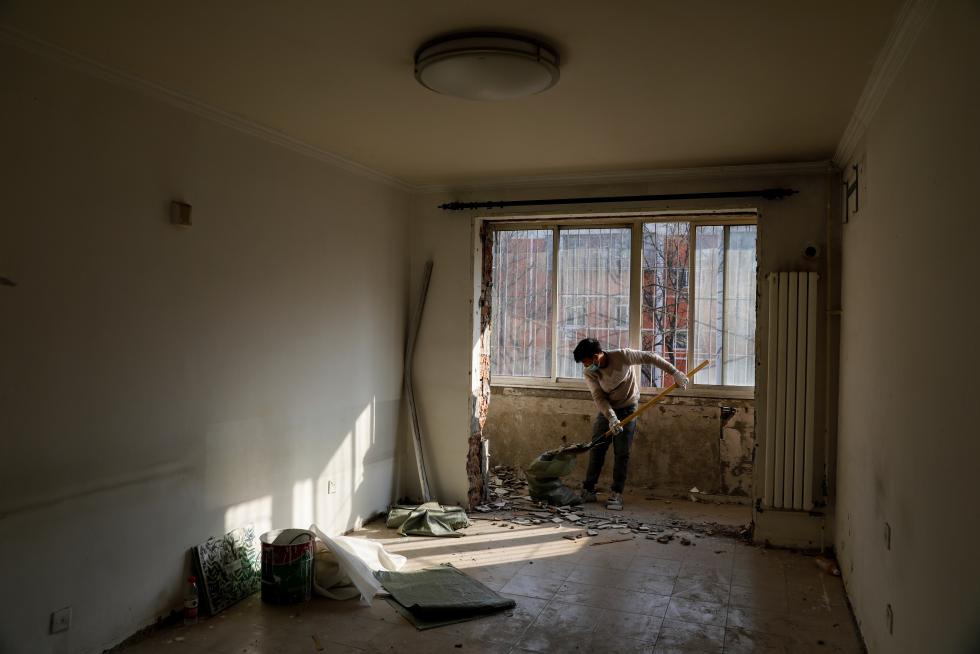 The Wider Image: 'I've let them down': Beijing's migrant workers miss family reunions on Lunar New Year