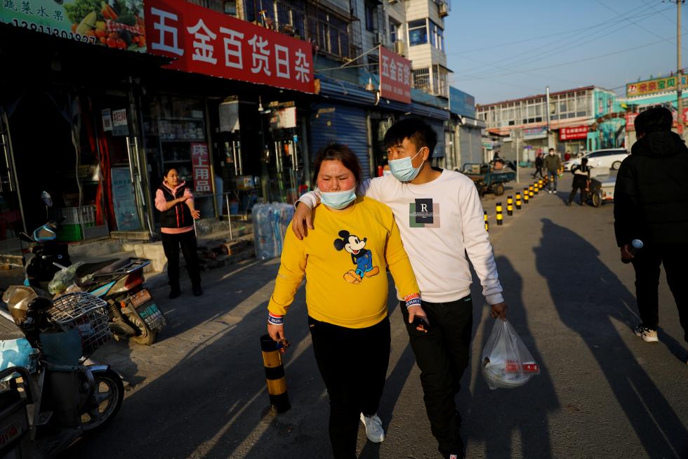The Wider Image: 'I've let them down': Beijing's migrant workers miss family reunions on Lunar New Year