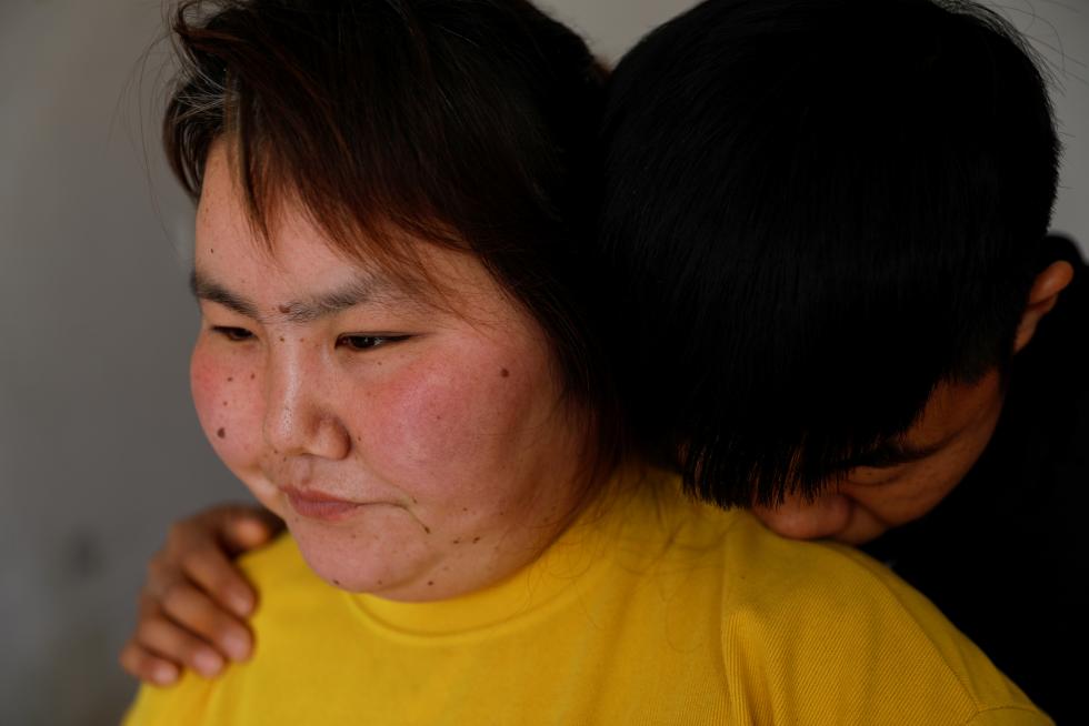 The Wider Image: 'I've let them down': Beijing's migrant workers miss family reunions on Lunar New Year