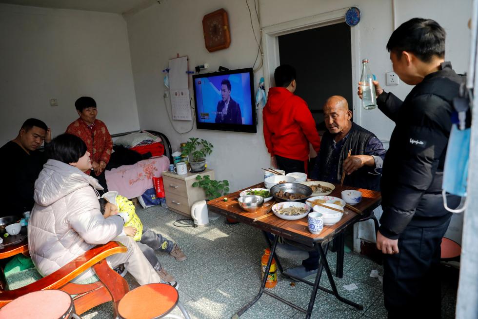 The Wider Image: 'I've let them down': Beijing's migrant workers miss family reunions on Lunar New Year