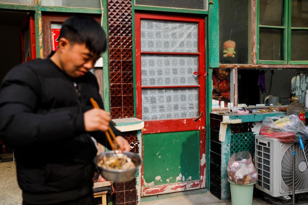 The Wider Image: 'I've let them down': Beijing's migrant workers miss family reunions on Lunar New Year
