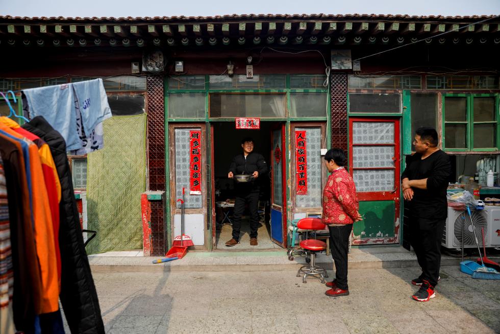 The Wider Image: 'I've let them down': Beijing's migrant workers miss family reunions on Lunar New Year