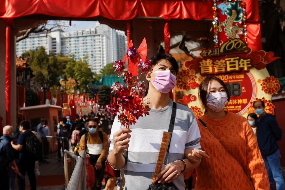 Worshippers wearing face masks visit Wong Tai Sin Temple at the first day of Chinese Lunar New Year, following the coronavirus disease (COVID-19) outbreak, in Hong Kong