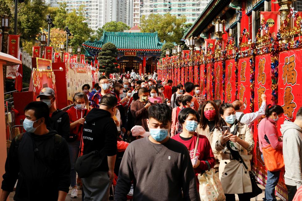 Worshippers wearing face masks visit Wong Tai Sin Temple at the first day of Chinese Lunar New Year, following the coronavirus disease (COVID-19) outbreak, in Hong Kong