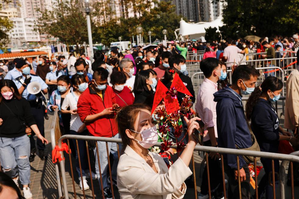 Worshippers wearing face masks visit Wong Tai Sin Temple at the first day of Chinese Lunar New Year, following the coronavirus disease (COVID-19) outbreak, in Hong Kong