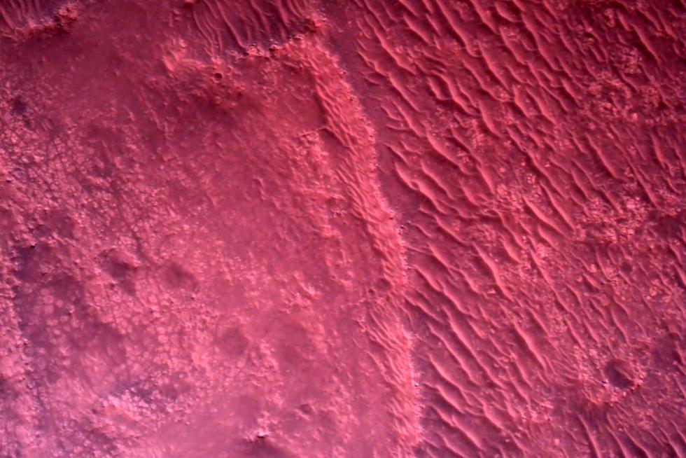 The surface of Mars directly below NASA's Mars Perseverance rover is seen using the Rover Down-Look Camera