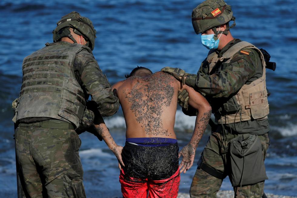Thousands of migrants cross the Spanish-Moroccan border