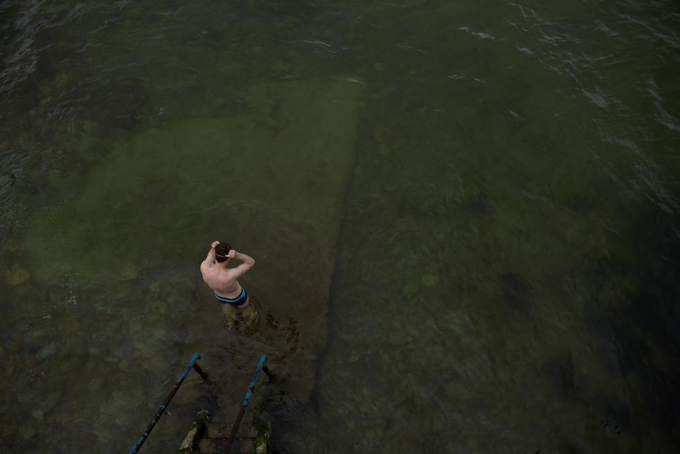 People swim on a cold day in Galway