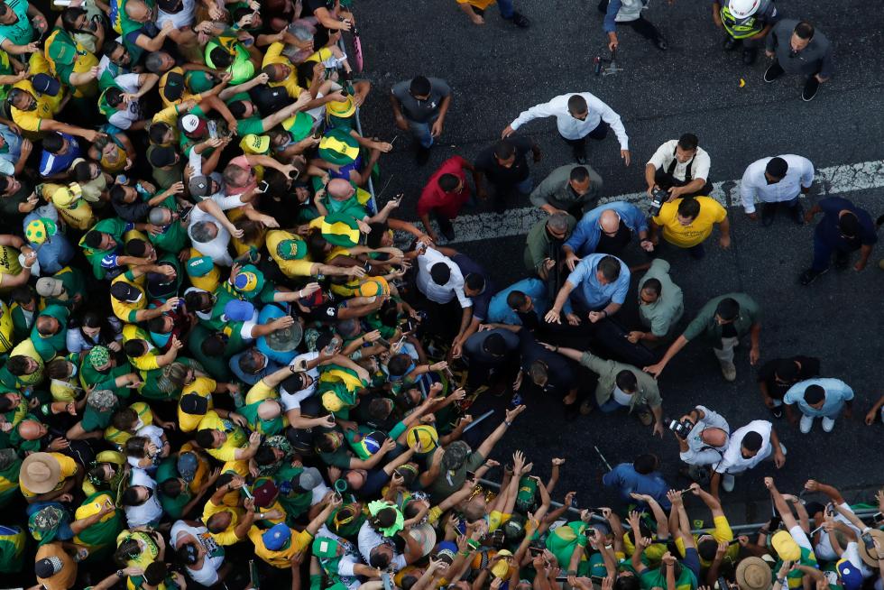 Brazilian President Jair Bolsonaro greets his supporters as they gather to back the far-right leader in his dispute with the Supreme Court, in Sao Paulo