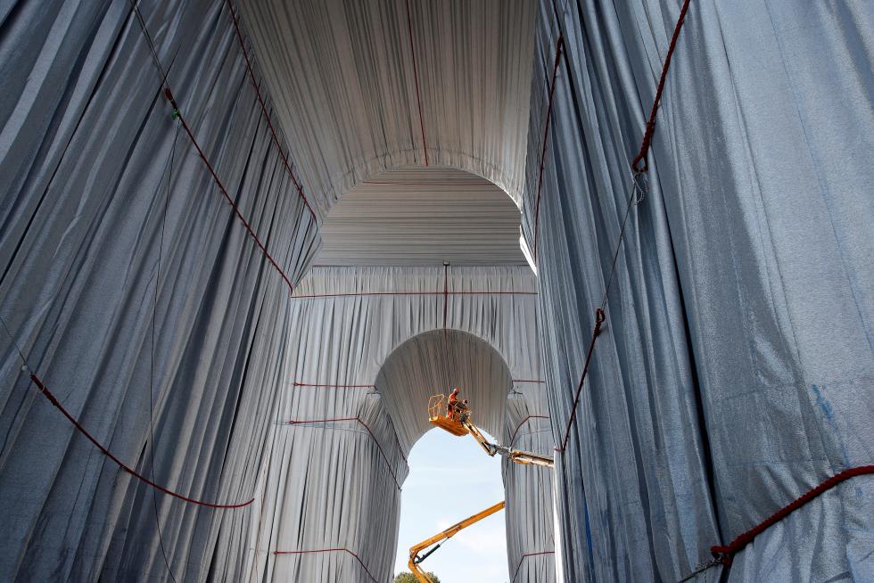 Arc de Triomphe enveloped by a shimmering wrapper in a posthumous installation by artist Christo