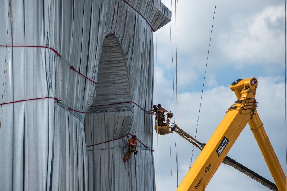 Wrapping of landmark Arc de Triomphe monument in Paris