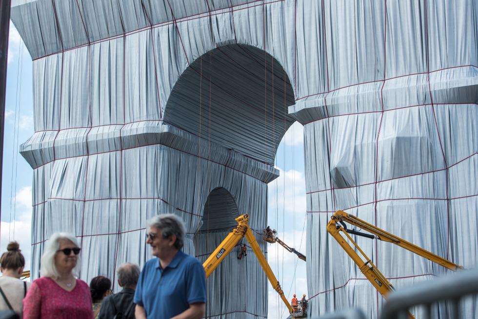 Wrapping of landmark Arc de Triomphe monument in Paris