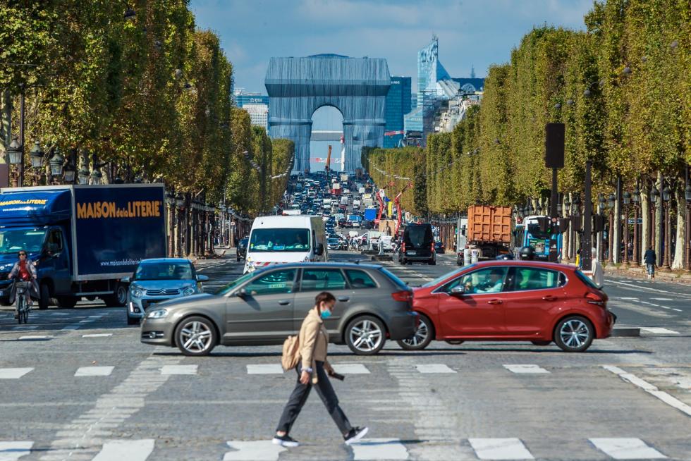 Wrapping of landmark Arc de Triomphe monument in Paris