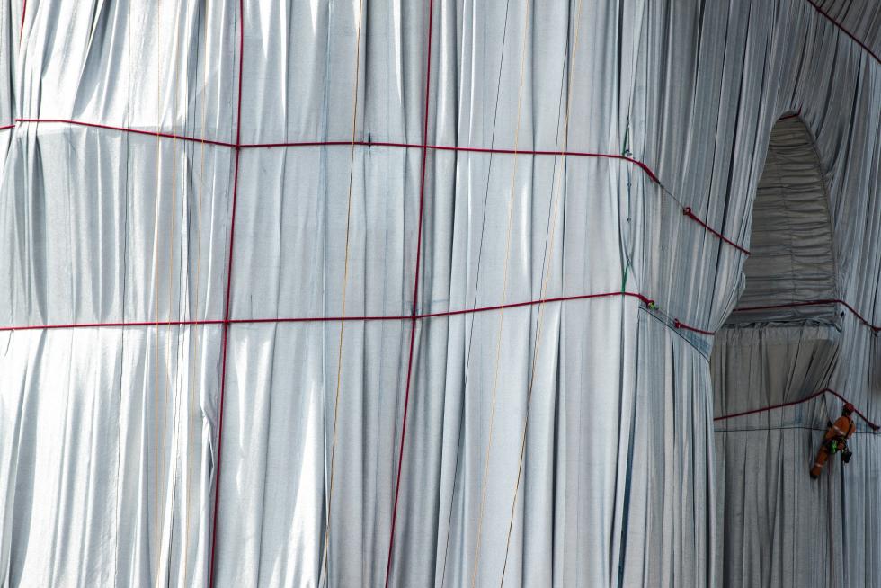 Wrapping of landmark Arc de Triomphe monument in Paris