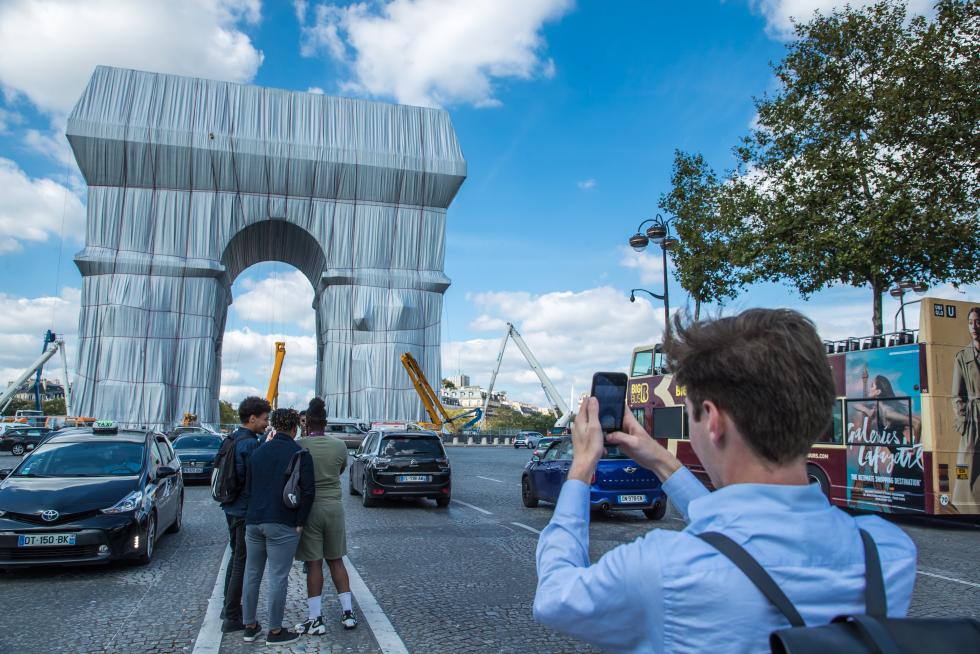 Wrapping of landmark Arc de Triomphe monument in Paris