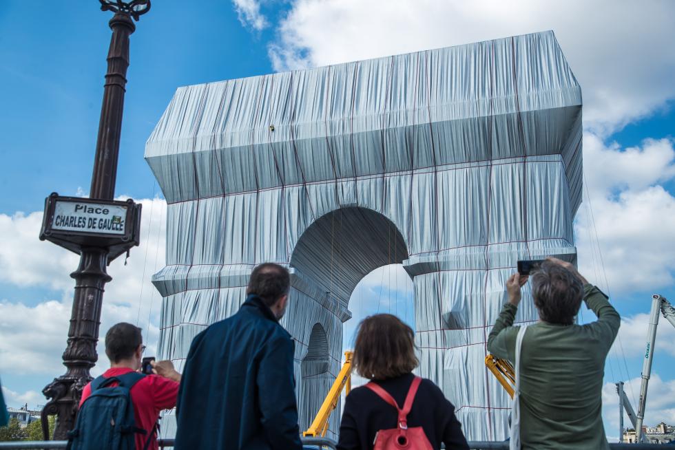 Wrapping of landmark Arc de Triomphe monument in Paris