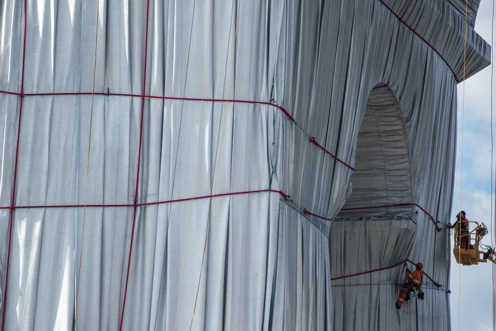Wrapping of landmark Arc de Triomphe monument in Paris