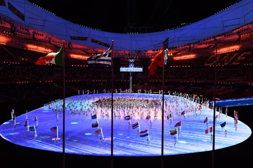 2022 Beijing Olympics - Closing Ceremony - National Stadium, Beijing, China - February 20, 2022. Fireworks explode above the stadium as performers, a snowflake and the Olympic rings are seen during the closing ceremony. REUTERS/Phil Noble OLYMPICS-2022-CLOSING/