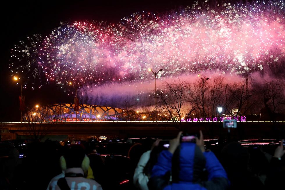 Fireworks explode over the National Stadium, also known as the Bird's Nest, at the end of the closing ceremony of the Beijing 2022 Winter Olympics, in Beijing, China February 20, 2022. REUTERS/Tyrone Siu TPX IMAGES OF THE DAY OLYMPICS-2022-CLOSING/