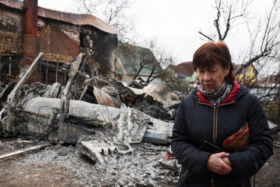 Rescuers help a local resident after shelling in the town of Starobilsk in the Luhansk region, Ukraine, in this handout picture released February 25, 2022. Press service of the Ukrainian State Emergency Service/Handout via REUTERS ATTENTION EDITORS - THIS IMAGE HAS BEEN SUPPLIED BY A THIRD PARTY. UKRAINE-CRISIS/
