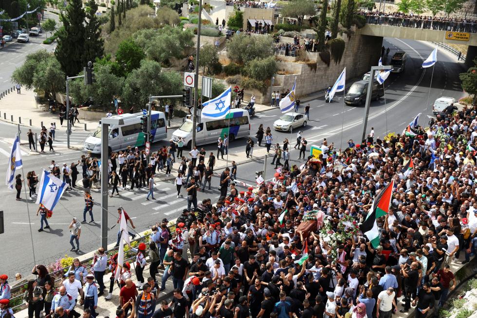 Family and friends attend the funeral of Al Jazeera reporter Shireen Abu Akleh, who was killed during an Israeli raid in Jenin in the occupied West Bank, in Jerusalem, May 13, 2022. REUTERS/Ammar Awad ISRAEL-PALESTINIANS/JOURNALIST