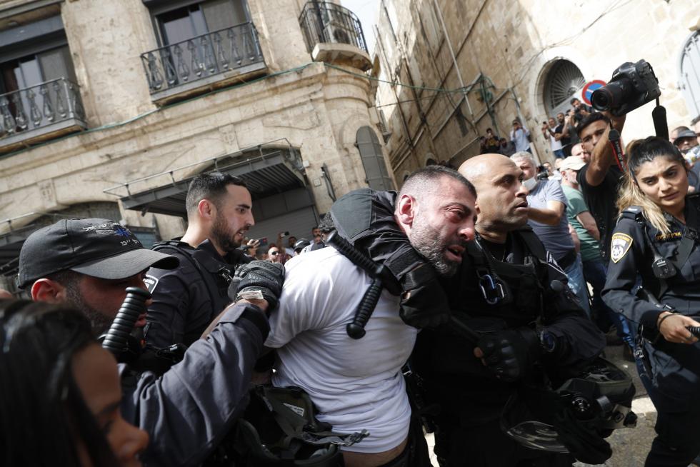 Family and friends carry the coffin of Al Jazeera reporter Shireen Abu Akleh, who was killed during an Israeli raid in Jenin in the occupied West Bank, during her funeral in a church in Jerusalem, May 13, 2022. REUTERS/Ammar Awad ISRAEL-PALESTINIANS/JOURNALIST