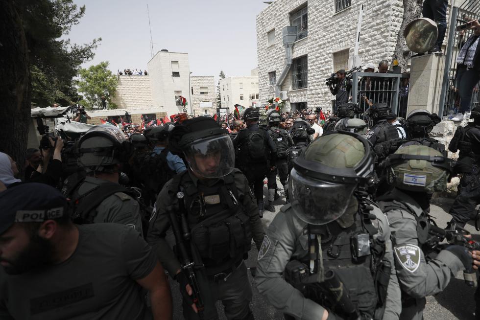 Family and friends carry the coffin of Al Jazeera reporter Shireen Abu Akleh, who was killed during an Israeli raid in Jenin in the occupied West Bank, during her funeral in a church in Jerusalem, May 13, 2022. REUTERS/Ammar Awad ISRAEL-PALESTINIANS/JOURNALIST