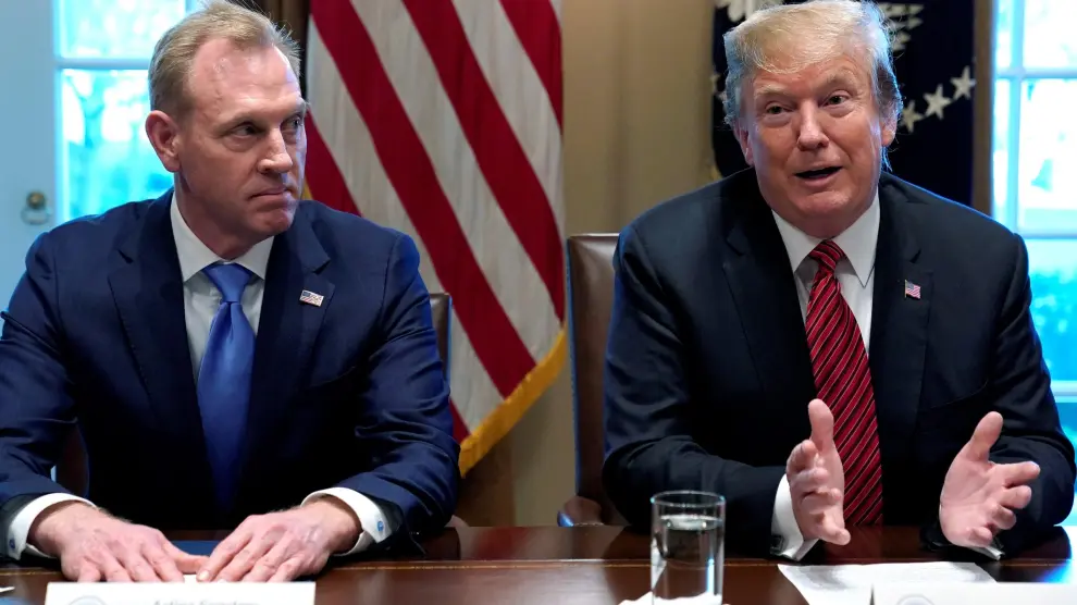 FILE PHOTO: Acting Defense Secretary Patrick Shanahan  (L) listens as U.S. President Donald Trump holds a meeting with senior military leaders at the White House in Washington, U.S., April 3, 2019.  REUTERS/Kevin Lamarque/File Photo [[[REUTERS VOCENTO]]] USA-TRUMP/SHANAHAN