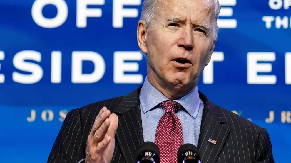 FILE PHOTO: U.S. President-elect Joe Biden speaks as he announces members of economics and jobs team at his transition headquarters in Wilmington, Delaware, U.S., January 8, 2021. REUTERS/Kevin Lamarque/File Photo[[[REUTERS VOCENTO]]] USA-BIDEN/DEESE-CLIMATE