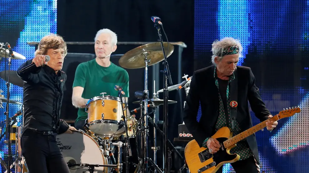FILE PHOTO: Mick Jagger, Charlie Watts and Keith Richards of the Rolling Stones perform during a concert in Abu Dhabi