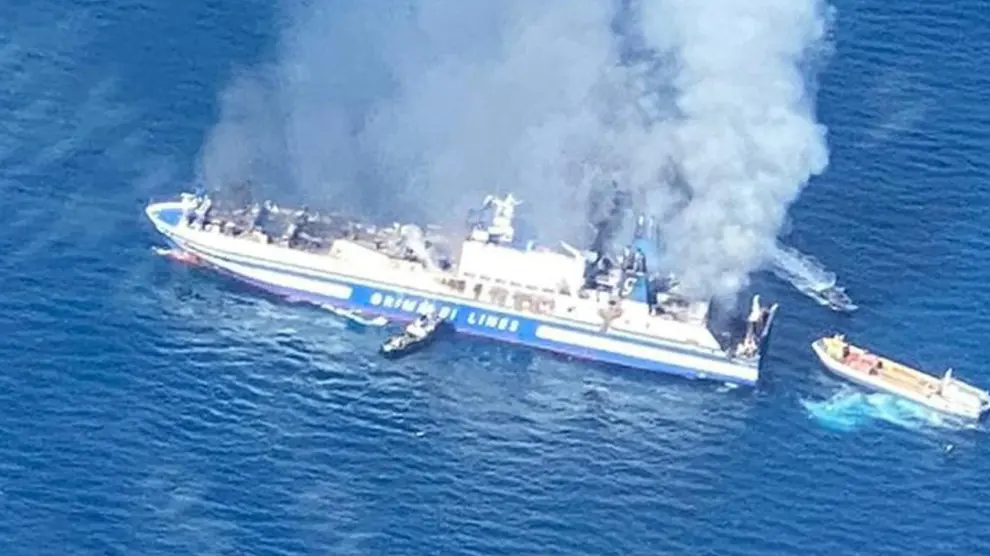 The Italian-flagged Grimaldi Euroferry Olympia, that caught fire off the island of Corfu, is seen from the Guardia di Finanza vessel, Greece, February 18, 2022. In this screengrab taken from video. Guardia di Finanza Press Office/Handout via REUTERS ATTENTION EDITORS - THIS IMAGE HAS BEEN SUPPLIED BY A THIRD PARTY. NO RESALES. NO ARCHIVES GREECE-FERRY/FIRE