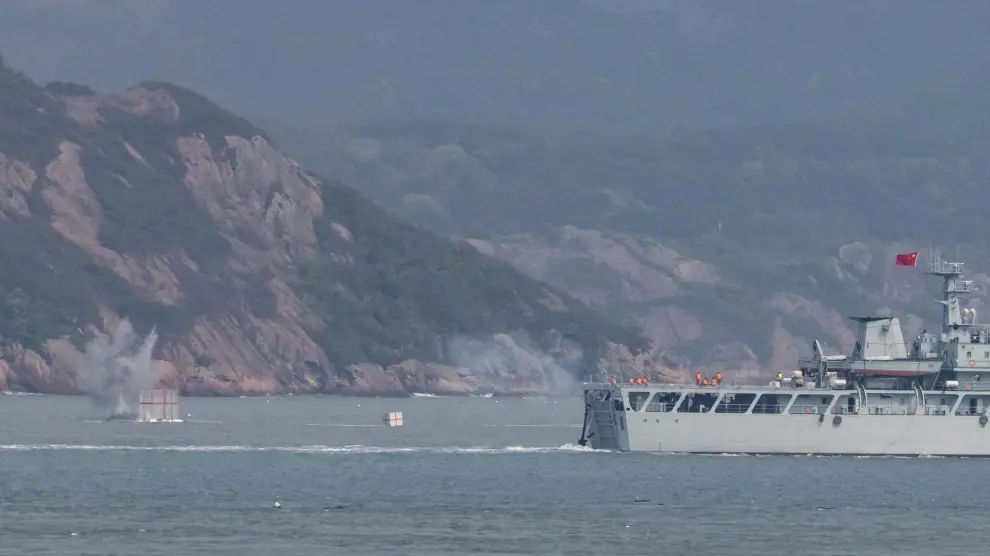 A Chinese warship fires towards the shore during a military drill near Fuzhou near the Taiwan controlled Matsu Islands