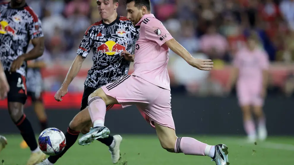 Aug 26, 2023; Harrison, New Jersey, USA; Inter Miami CF forward Lionel Messi (10) controls the ball against New York Red Bulls midfielder Peter Stroud (5) during the second half at Red Bull Arena. Mandatory Credit: Brad Penner-USA TODAY Sports