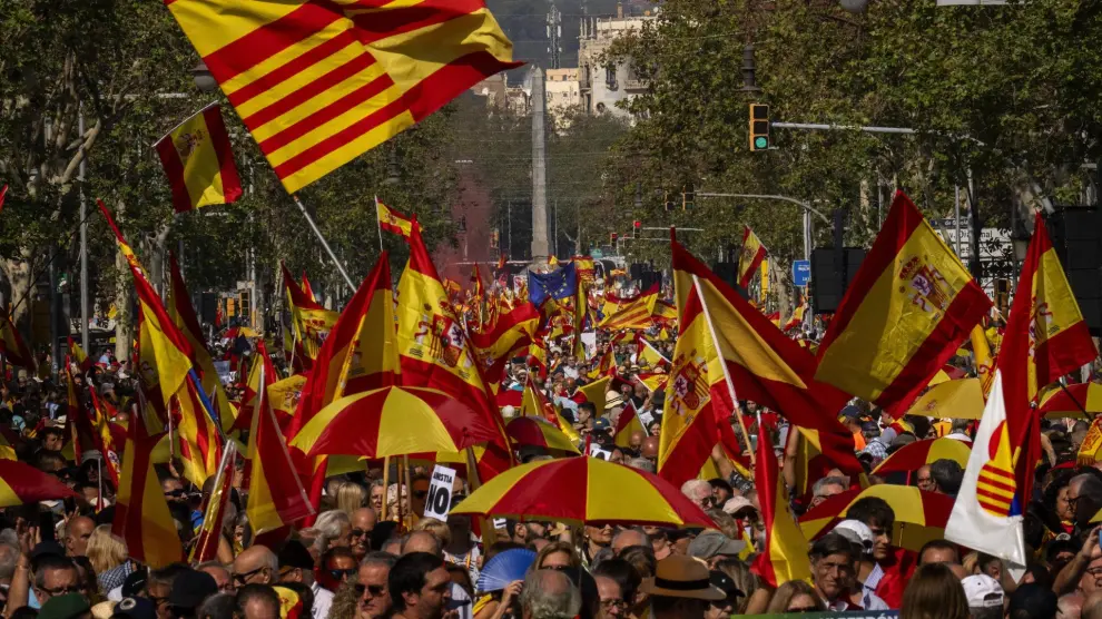 Demonstrators march during a protest organized by Sociedad Civil Catalana in Barcelona Spain, Sunday, Oct. 8, 2023. Thousands protest against the possibility of Spain's left-wing government proposing an amnesty for hundreds of people in legal trouble for involvement in Catalonia's separatist movement. (AP Photo/Emilio Morenatti)