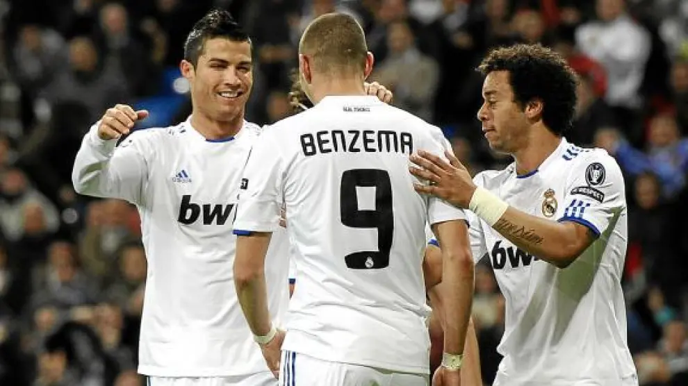 Benzemá, Cristiano Ronaldo y Marcelo, celebran un gol en una imagen de archivo.