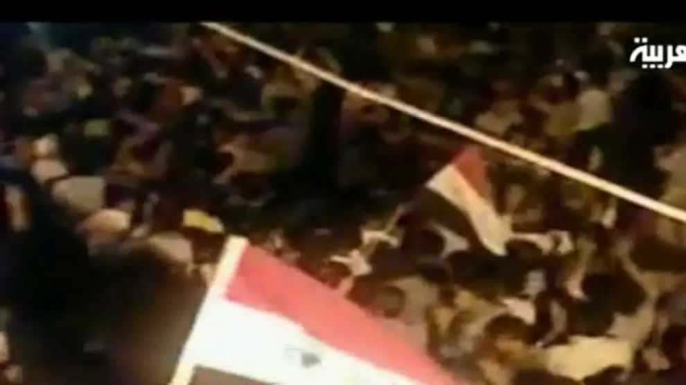 Captura de vídeo tomada del canal de televisión Al Arabiya, que muestra unas protestas en una ciudad desconocida en Siria