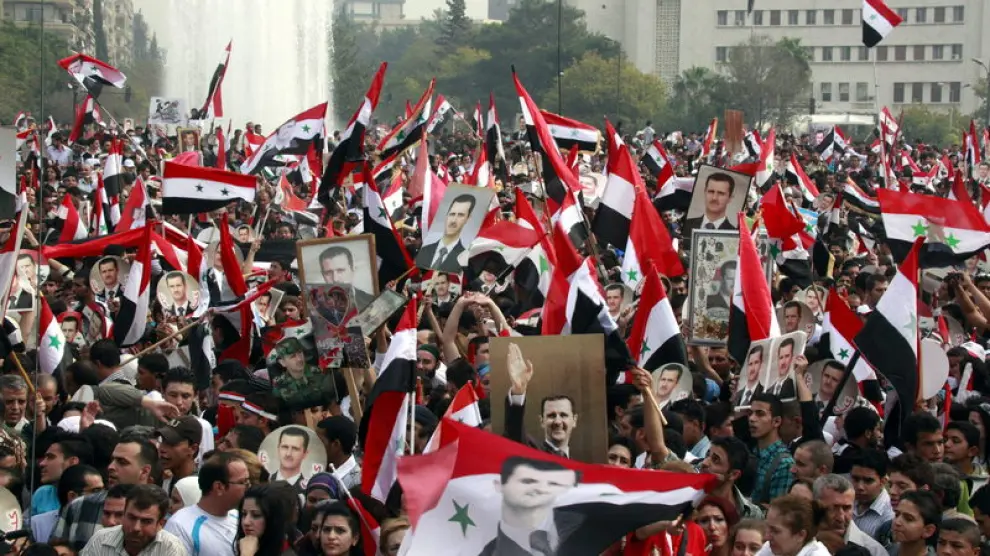 Sirios participan en una concentración de partidarios del presidente Bachar al Asad